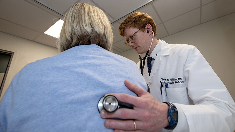 A Cardiovascular Disease Fellow meets with a patient. A Cardiovascular Disease Fellow meets with a patient.